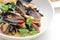 Cooked mussels in a with bowl