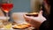 Cooked mussels served. A man eating the mussel with a fork