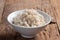 Cooked peeled barley grains in white bowl