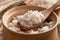 Cooked peeled barley grains in wooden bowl