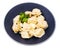 Cooked Pelmeni decorated with parsley in bowl