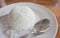 Cooked rice fork and spoon in white dish