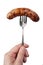 Cooked sausage on a fork