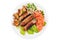 Cooked sausages with green lettuce, tomato, mushrooms and onion on a plate