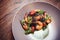 Cooked shrimps,prawns with seasonings on stone background. Fried shrimp with rosemary in a portioned frying pan on a dark table to