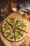 Cooked and sliced broccoli and cheese pizza