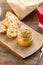 Cooked squash pasta in a jar with bread toast on wooden table