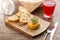 Cooked squash pasta in a jar with bread toast on wooden table