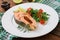 Cooked on steam salmon steak with vegetables