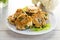 cooked vegetarian fried cauliflower cutlets, in a plate .