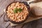 Cooked white kidney beans in a bowl closeup horizontal top view