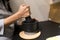 cooker hands pounding something using mortar and pestle