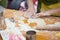 Cookery scene with female hands cutting cookies from raw dough w