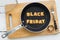 Cookie biscuits word BLACK FRIDAY in frying pan