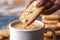 Cookie delight Sweet treats being poured into a coffee mug