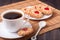 Cookie with heart jelly and cup of coffee bamboo napkin