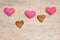 Cookie in heart shape and hearts on background