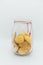 Cookie jar, simple glass jar filled with old fashioned cookies on off white background