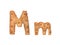 Cookie letter M on white background. Cookie font. Food sign ABC