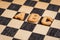 Cookie letters on an old checkboard surface