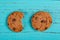 Cookies on blue background and one with a bite