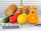 Cookies are in the cage locked with padlock. Vegetables, fruits and measuring tape with centimeters and inches are in the