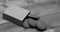 Cookies in carton box on grey wooden background. Sweet bakery and delicious snack. Baked meal concept.