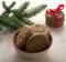 Cookies with chocolate in a beautiful bowl, next to a spruce branch. A bunch of cookies tied with a red ribbon, a bokeh