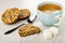 Cookies with different seeds , spoon, half of cookie, sugar, coffee in cup on wooden table