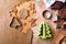 Cookies forms and gingerbread dough on wooden pastry board