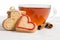 Cookies-hearts and a cup of tea on wooden table