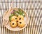 Cookies and lettuce leaves in wooden plate on wood table