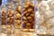 Cookies, marshmallows, sweets in glass jars on a shop window