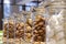 Cookies, marshmallows, sweets in glass jars on a shop window