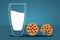 Cookies and Milk. Glass of milk and two cookies. Tasty breakfast. The concept of proper nutrition. Milk in glass, round