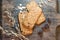 Cookies muesli made with raw organic cereals rice flour with chocolate on old wooden cutting Board.