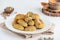 cookies with nuts and pista nuts are on a plate