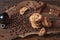 Cookies, pieces of chocolate and coffe beans over a wooden board