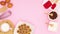 Cookies in plate and items for baking move in corner of pink theme. Stop motion