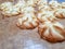 cookies in the shape of a brown background with deliciously baked edges