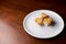 Cookies in the shape of hearts lying on a saucer