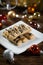 Cookies sticks on a small plate on wooden background