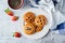 Cookies with strawberry filling in the plate. Spanish pastry