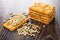 Cookies with sunflower seeds, scattered peeled seeds on dark wooden table