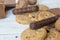 Cookies, walnut and chocolate on white wooden background