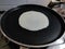 Cooking of Appam or Pathal special Kerala style bread for breakfast on a frying pan in an Indian kitchen