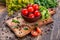 Cooking background. Fresh vegetables and peppers on wooden background. Ripe tomatoes and herbs