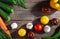 Cooking background, home cooking concept. Ripe tomatoes, spoon, herbs and spices on wooden background, top view, copy