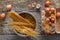 Cooking background. Vermicelli and eggs in carton, top view on rustic wood background