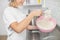 Cooking, bakery, dessert food and people concept. Close up cropped shot of young girl pastry chef with whisk, stirring